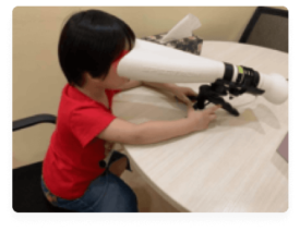 A young patient participates in advanced vision therapy, including syntonics, under the care of specialists at Buck & Todd Optometrist in Mackay